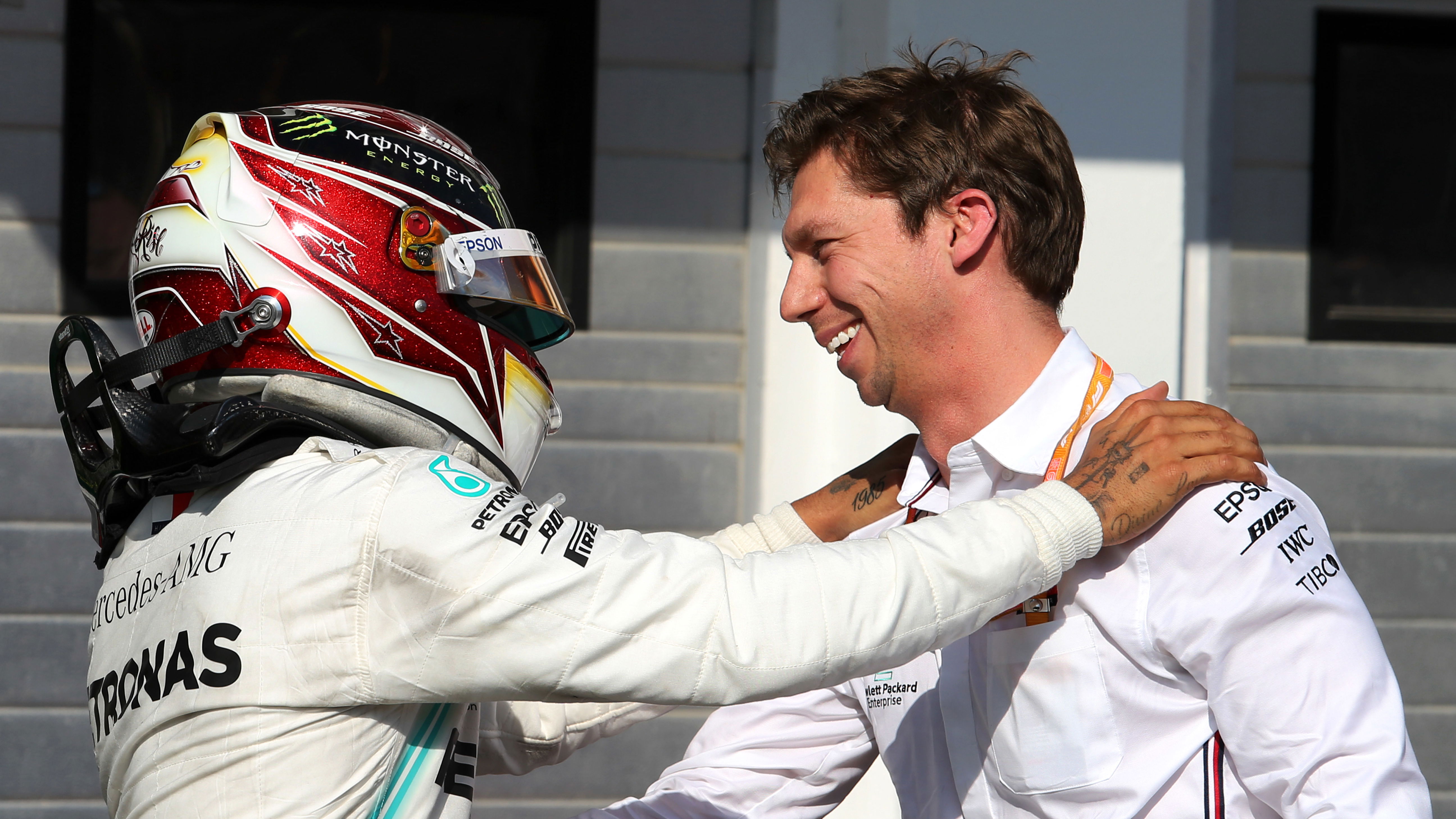 Lewis Hamilton celebrates in parc ferme with James Vowles at Mercedes.