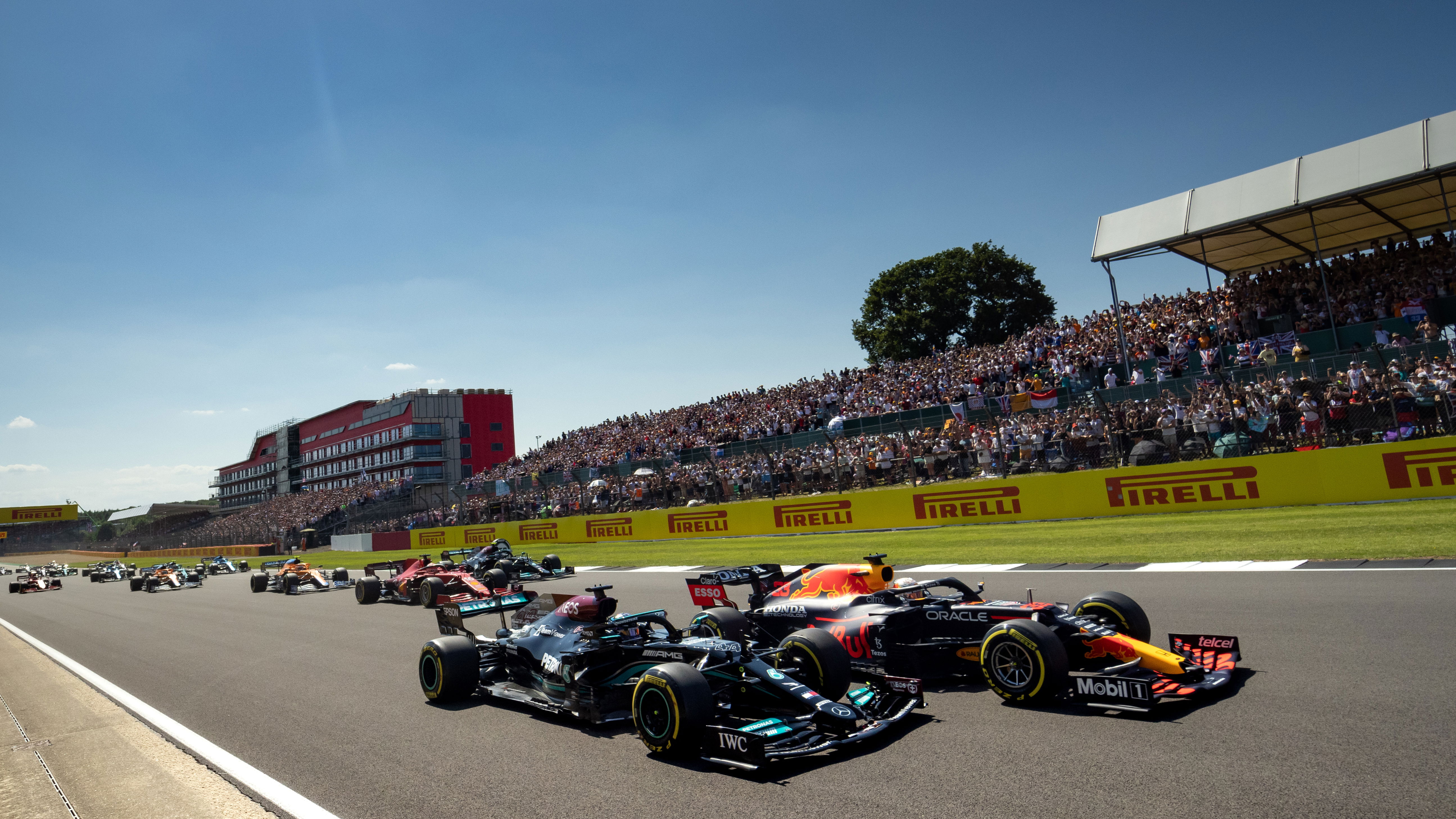 Lewis Hamilton and Max Verstappen go side-by-side at the 2021 British Grand Prix.