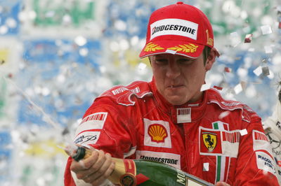 Kimi Raikkonen celebrates winning the 2007 title in Brazil.