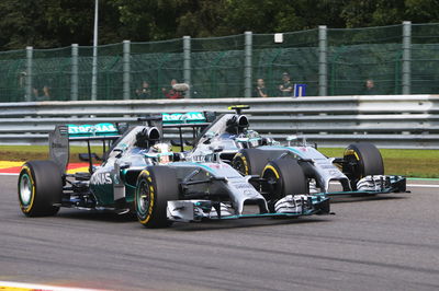 Lewis Hamilton and Nico Rosberg battle for the lead at the 2014 Belgian Grand Prix