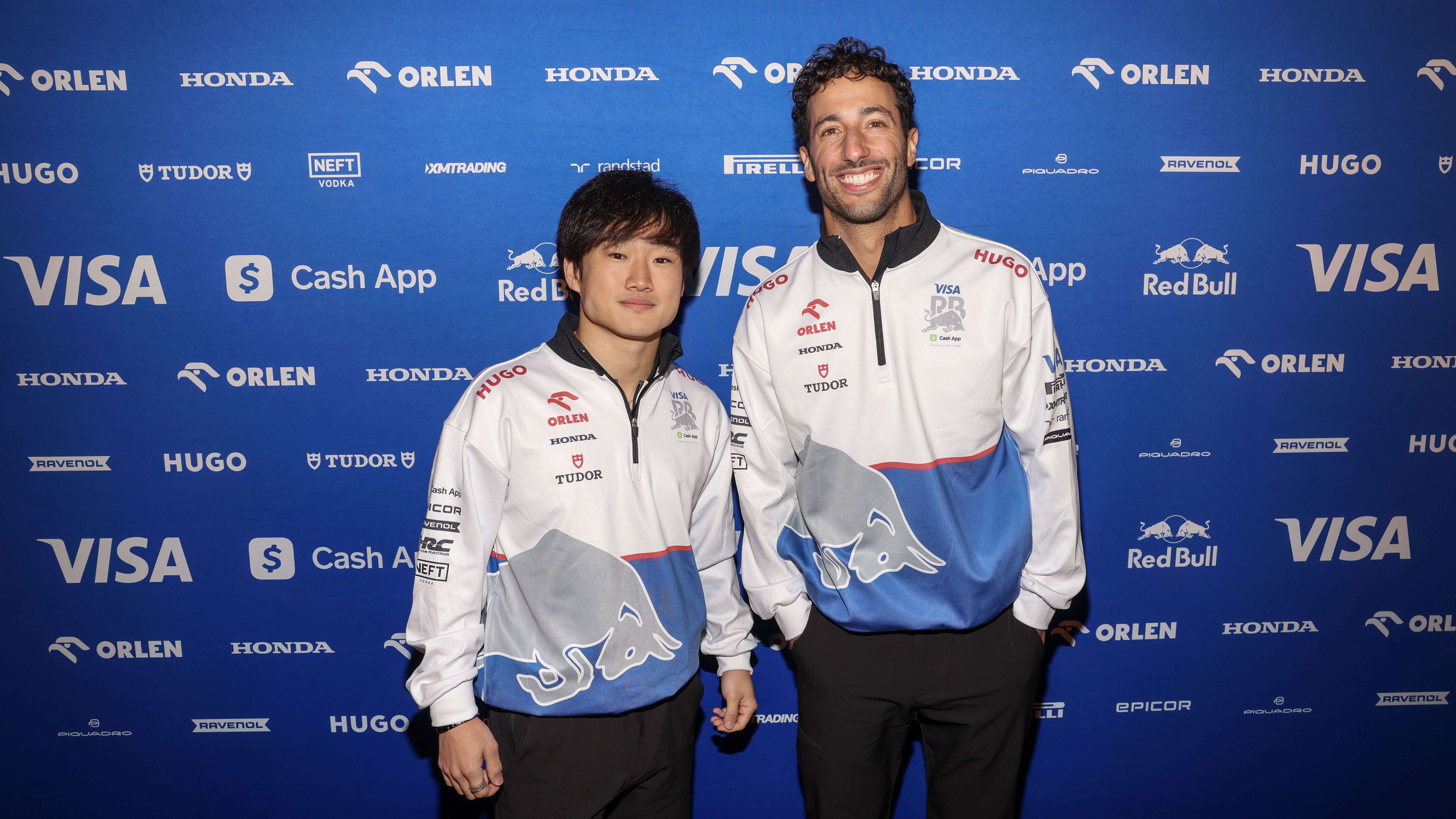 Yuki Tsunoda and Daniel Ricciardo pictured together at the launch of the Visa Cash App RB 2024 F1 car
