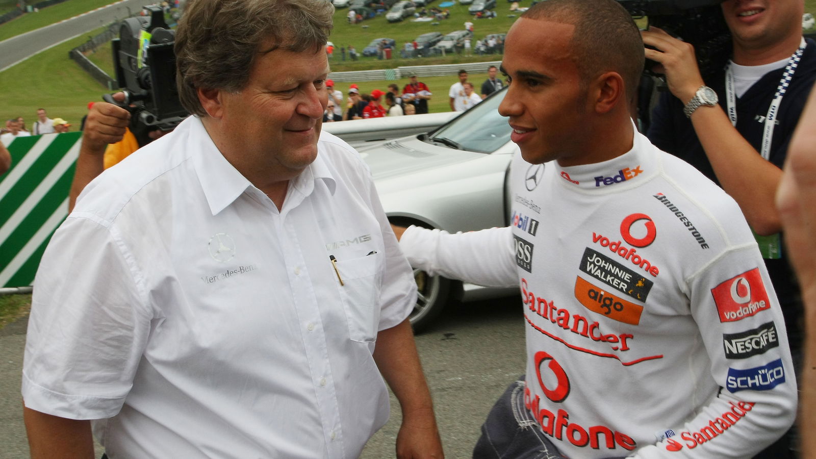 Norbert Haug pictured with Lewis Hamilton in 2008