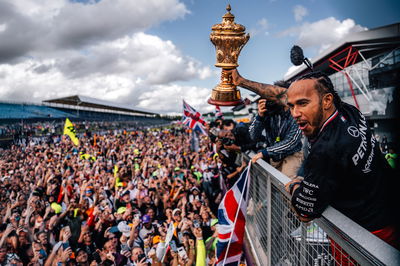 Lewis Hamilton celebrates with the Silverstone crowd