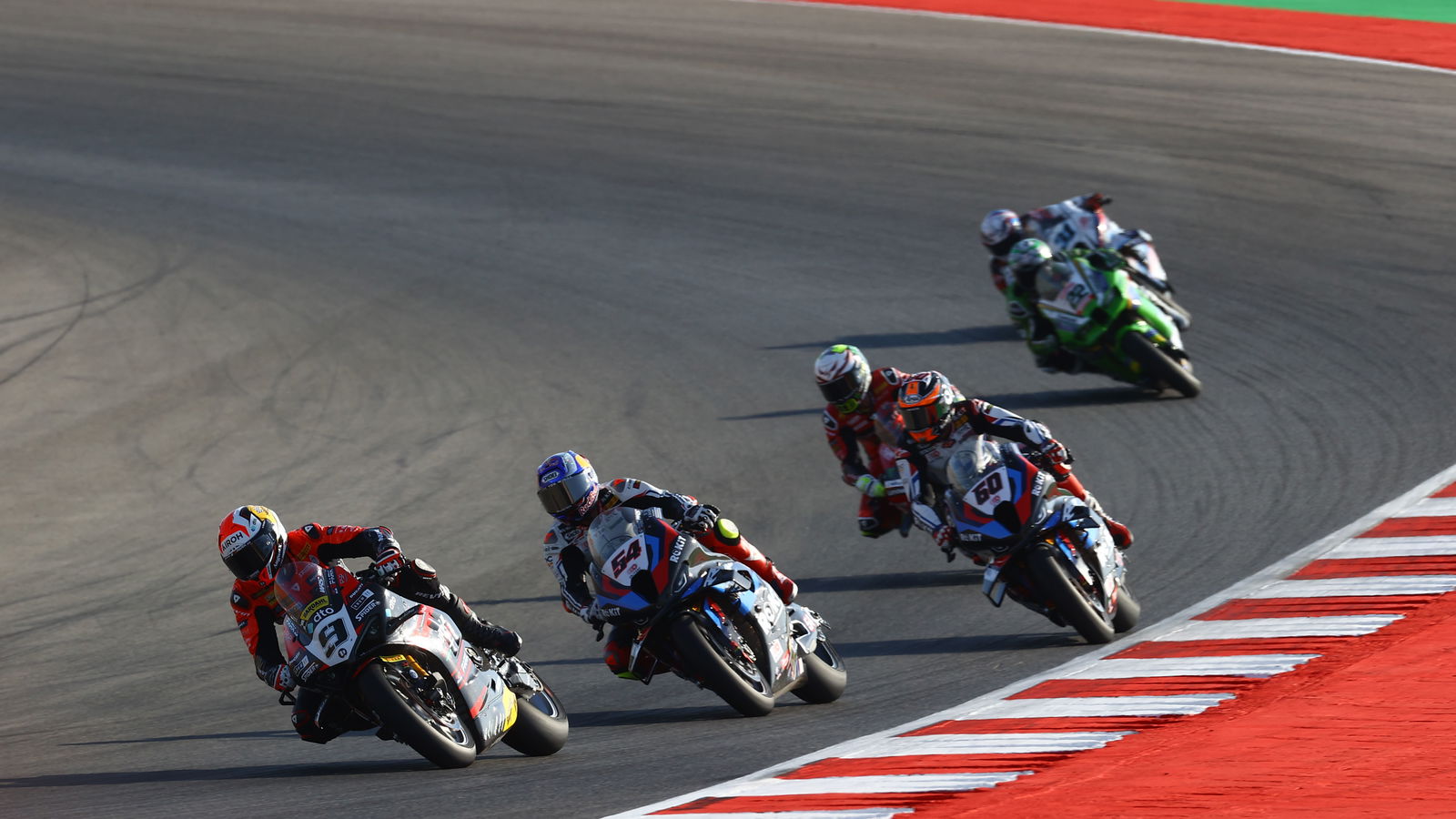 Danilo Petrucci leads Race 1, 2024 Portuguese WorldSBK. - Gold and Goose.