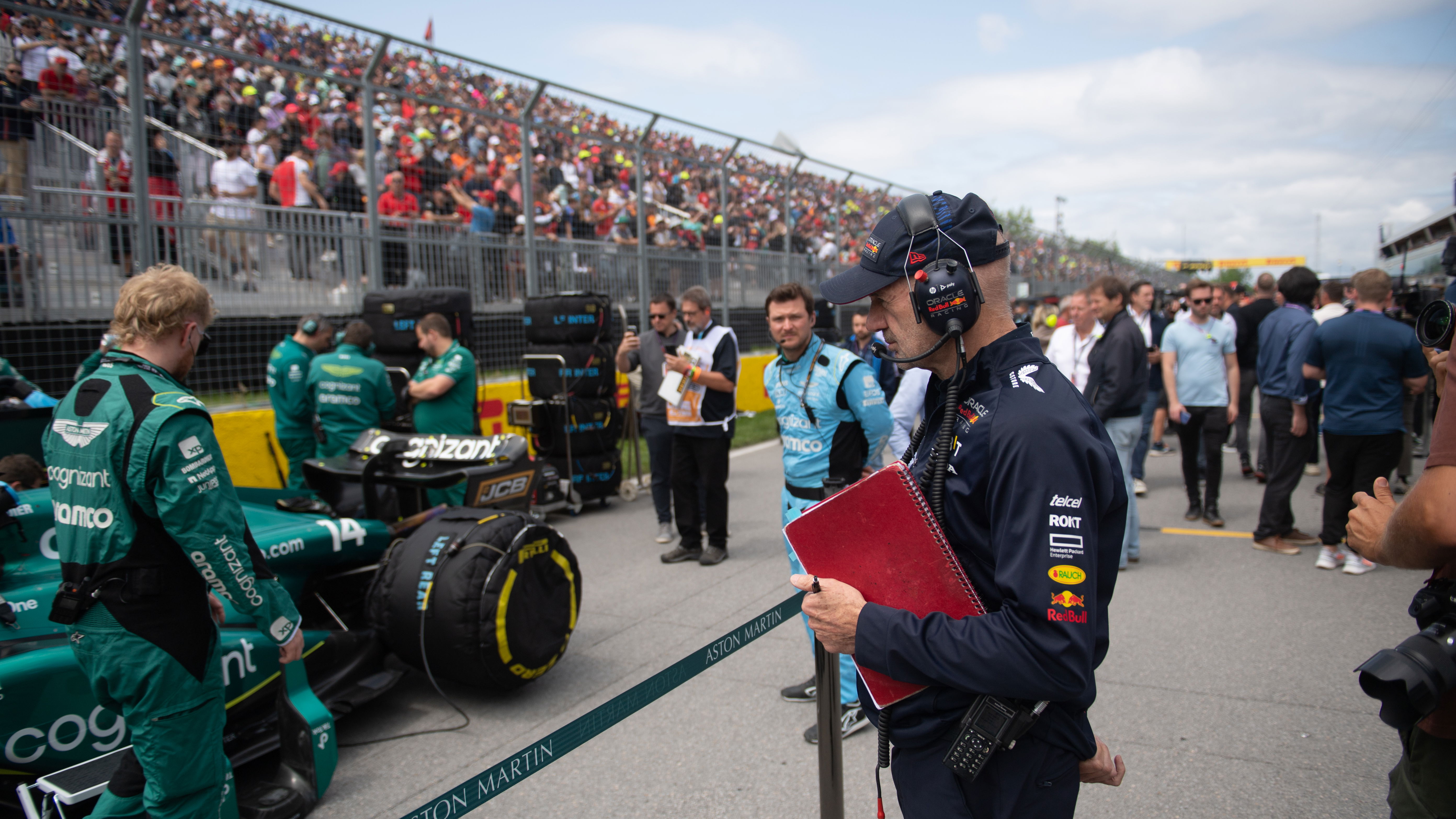 Adrian Newey looking at an Aston Martin 