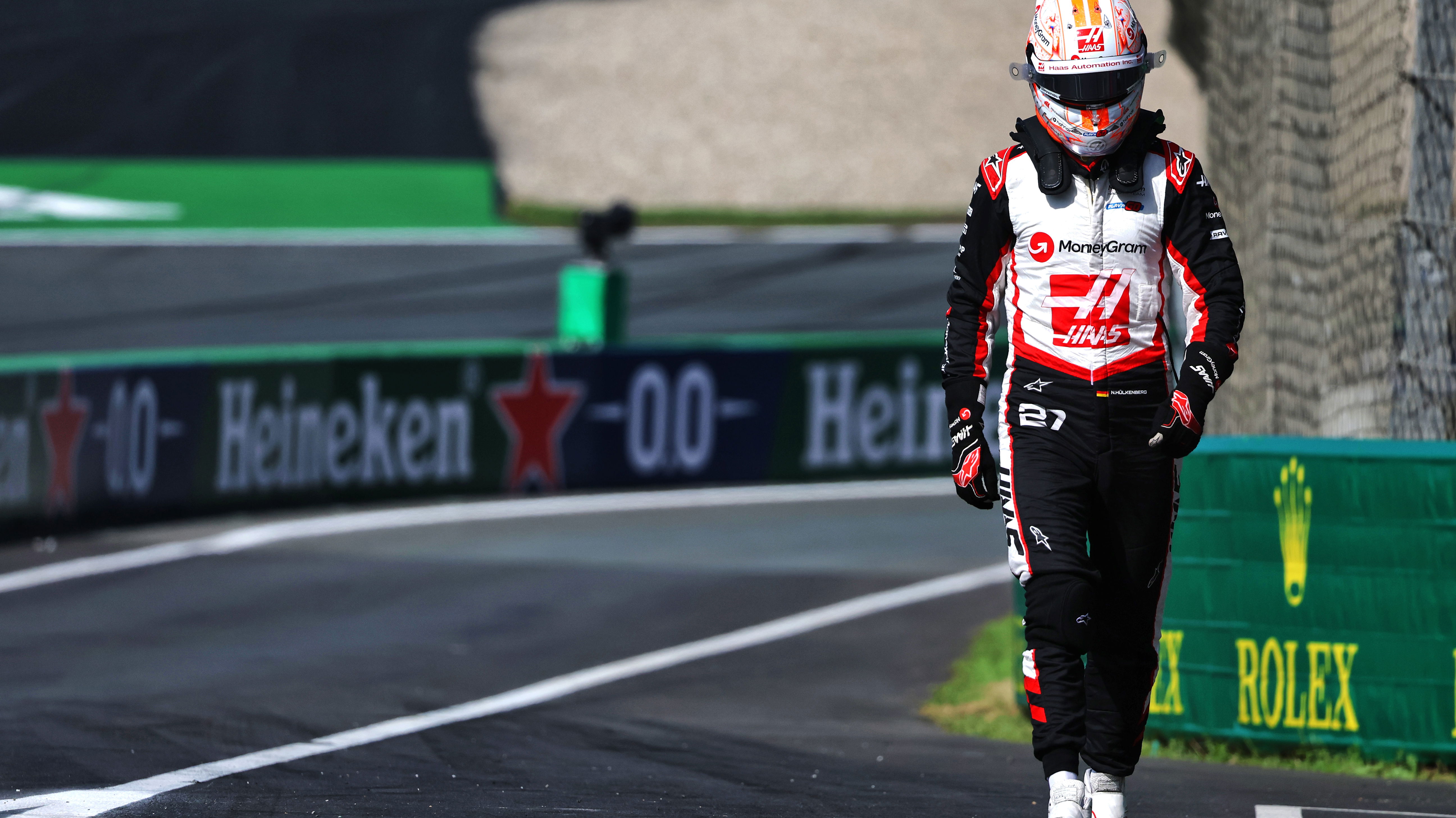 Nico Hulkenberg walks away after a crash at Turn 1