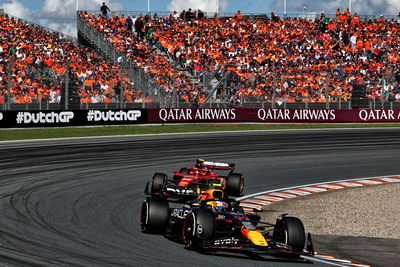 Sergio Perez battles with Carlos Sainz