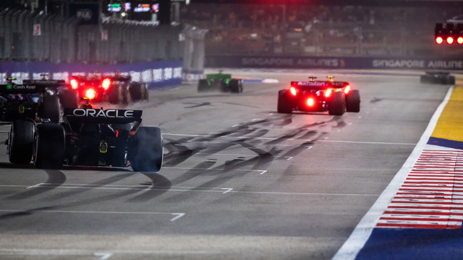 Drivers conduct practice starts on the grid