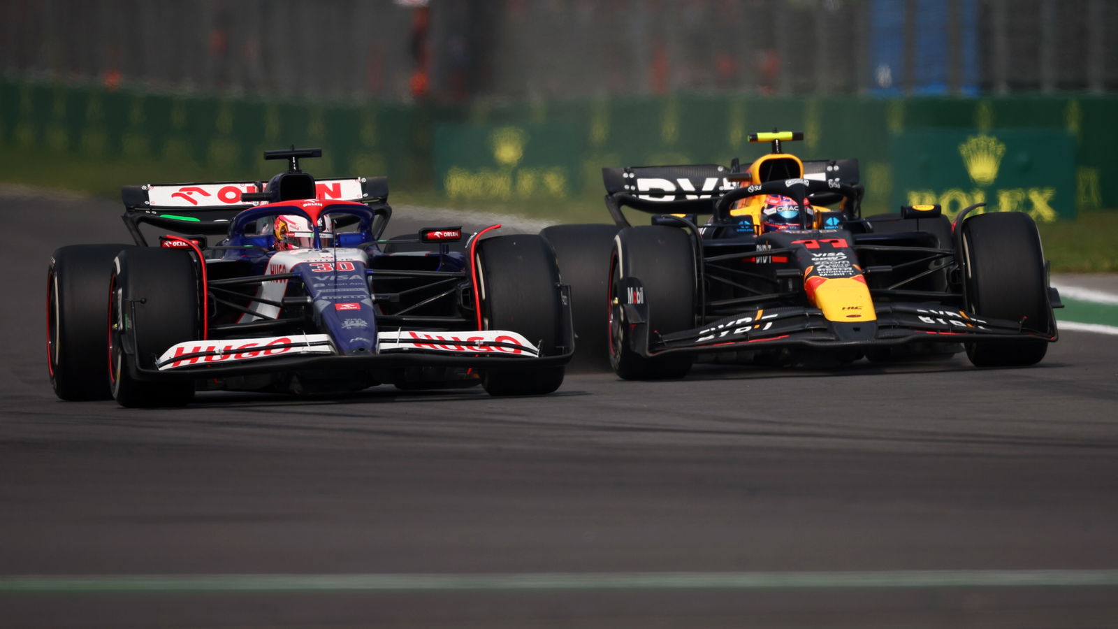 Liam Lawson and Sergio Perez do battle 