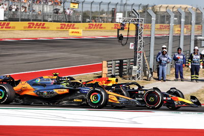 Lando Norris and Max Verstappen battle for third