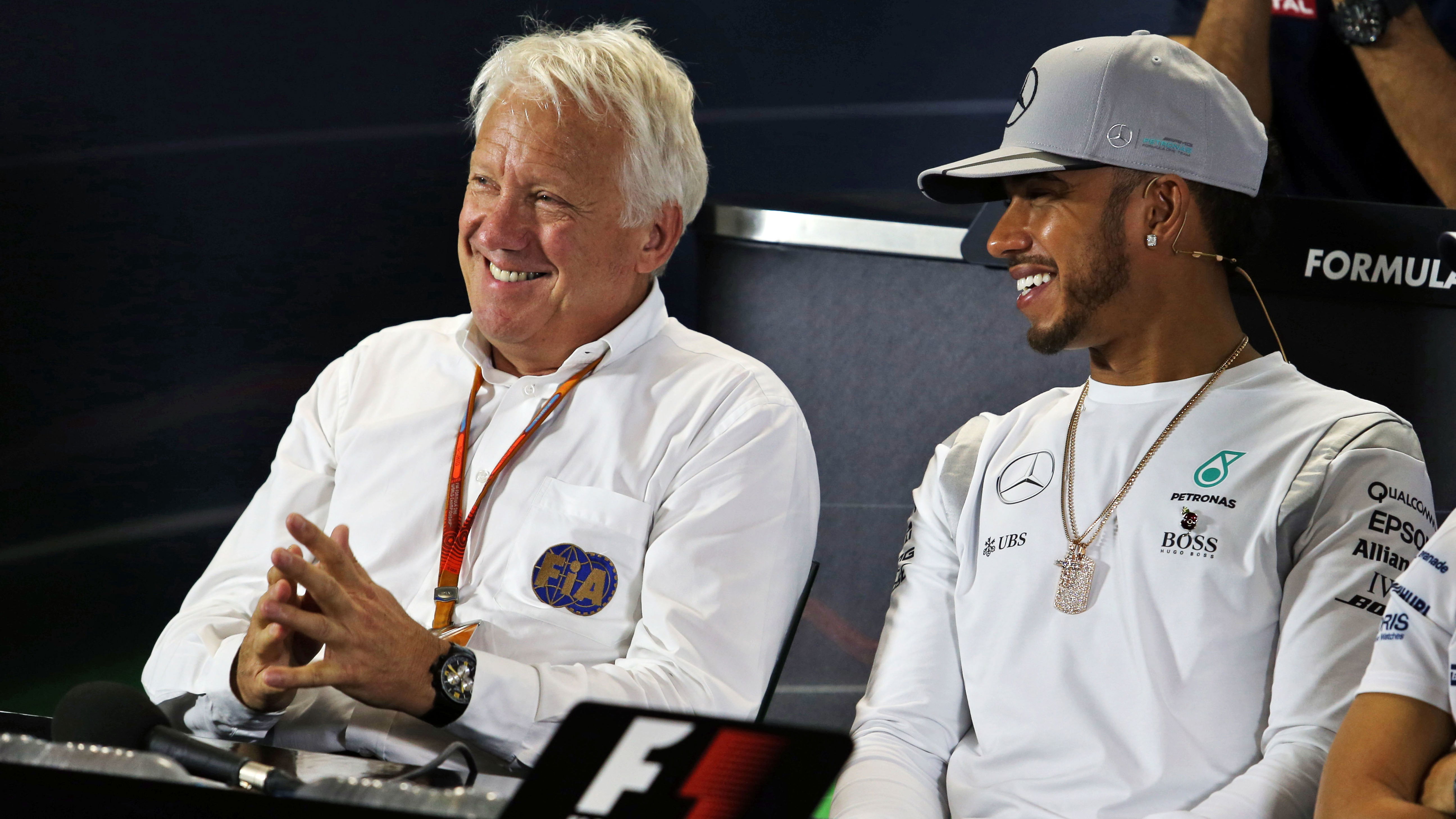 Late FIA race director Charlie Whiting and Lewis Hamilton