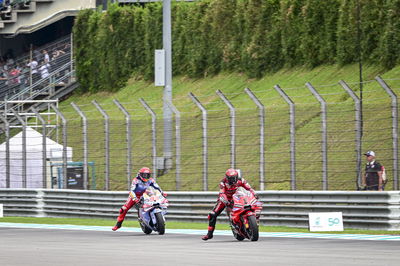 Francesco Bagnaia, Marc Marquez, 2024 MotoGP Malaysian Grand Prix, pit box. Credit: Gold and Goose.