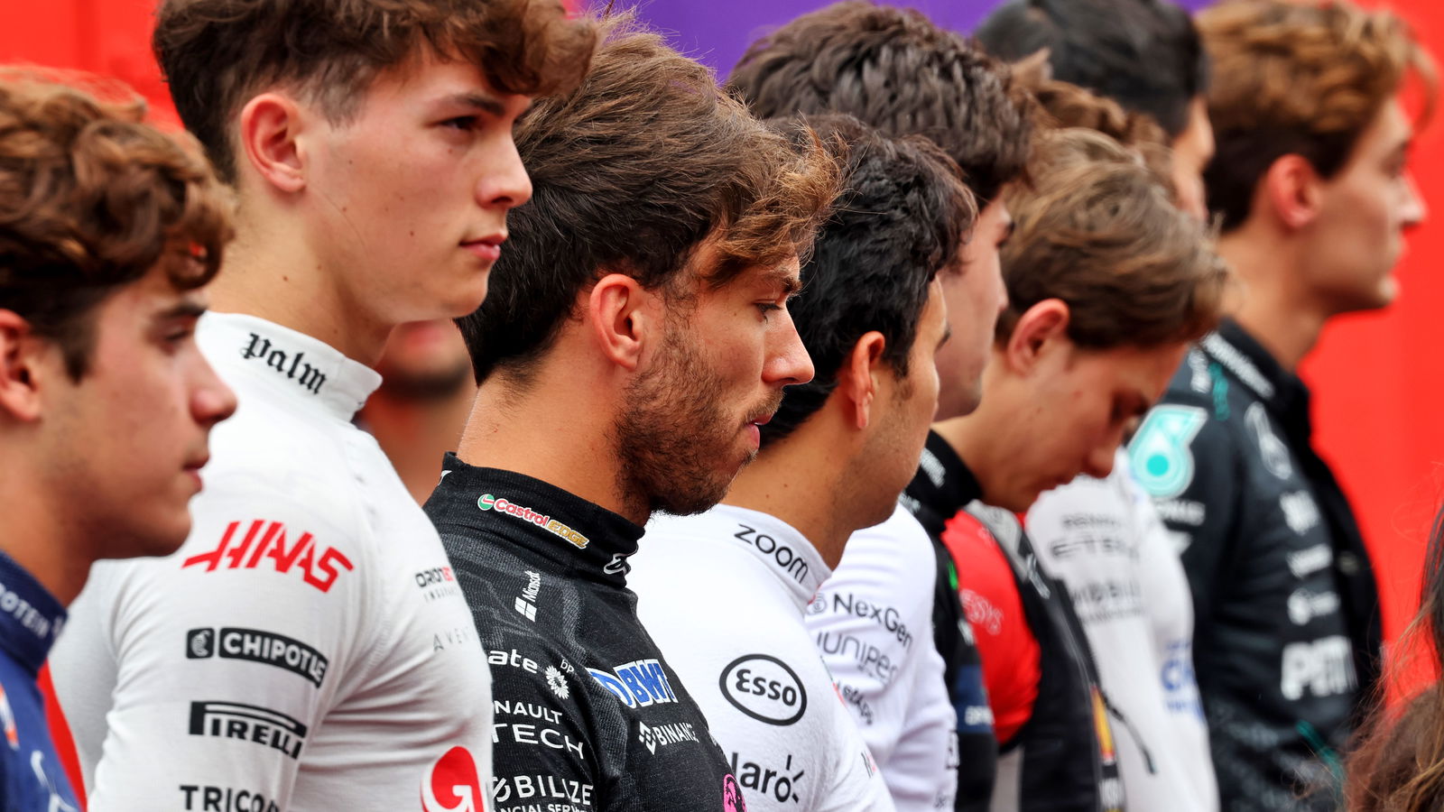 Drivers line up for the national anthem