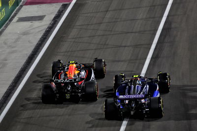 Franco Colapinto passes Sergio Perez at the start 