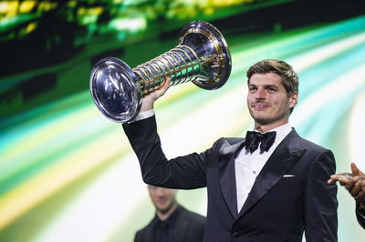 Max Verstappen collects his F1 championship trophy