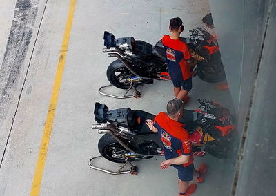 Dani Pedrosa's KTMs, featuring the revised 'salad box' and exhaust location, are warmed up ahead of day 3 at the Sepang Shakedown.