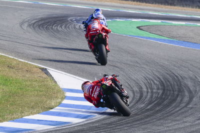 Francesco Bagnaia chases Marc Marquez, 2025 MotoGP Thai Grand Prix. Credit: Gold and Goose.