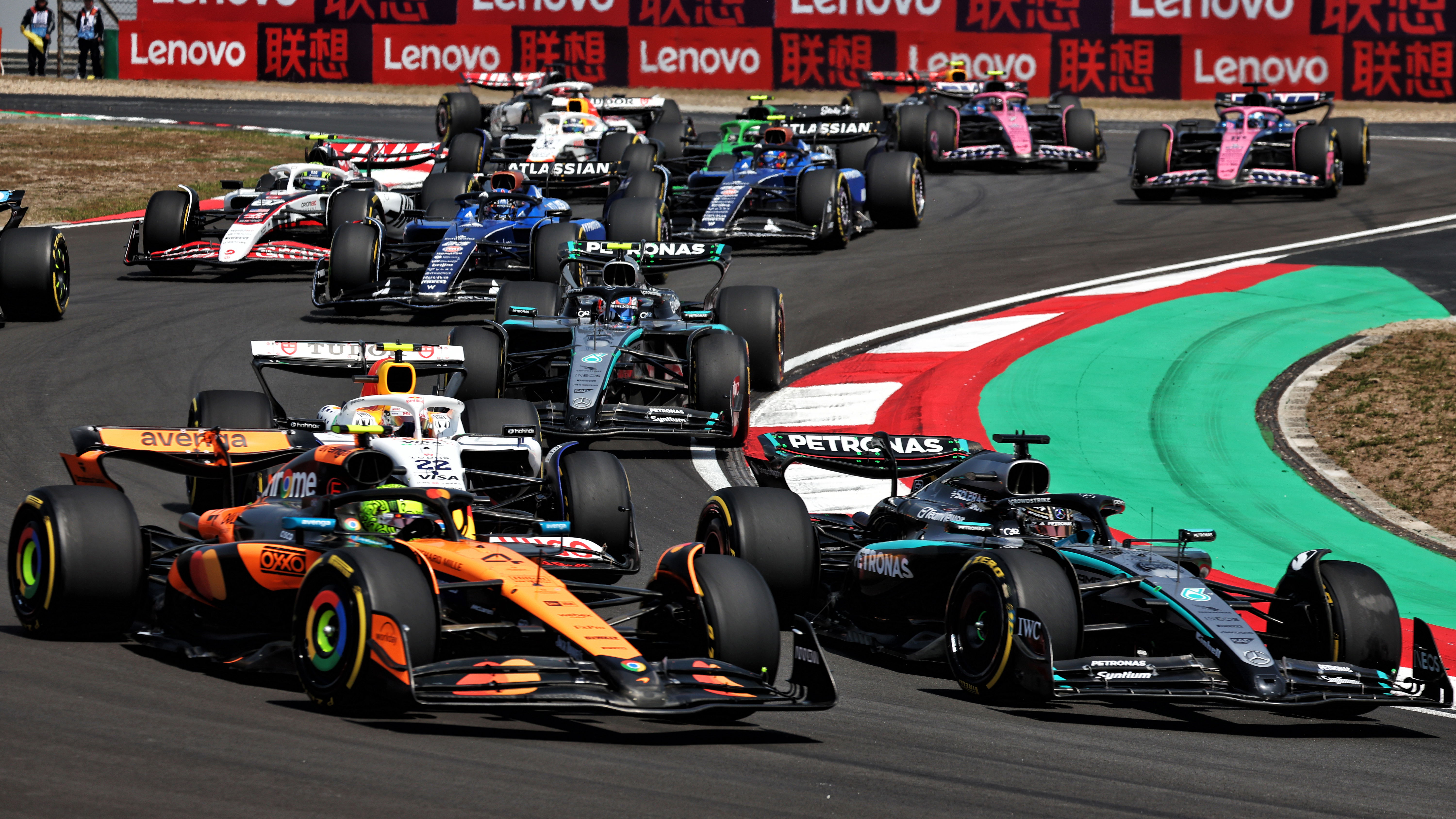 Lando Norris battles George Russell