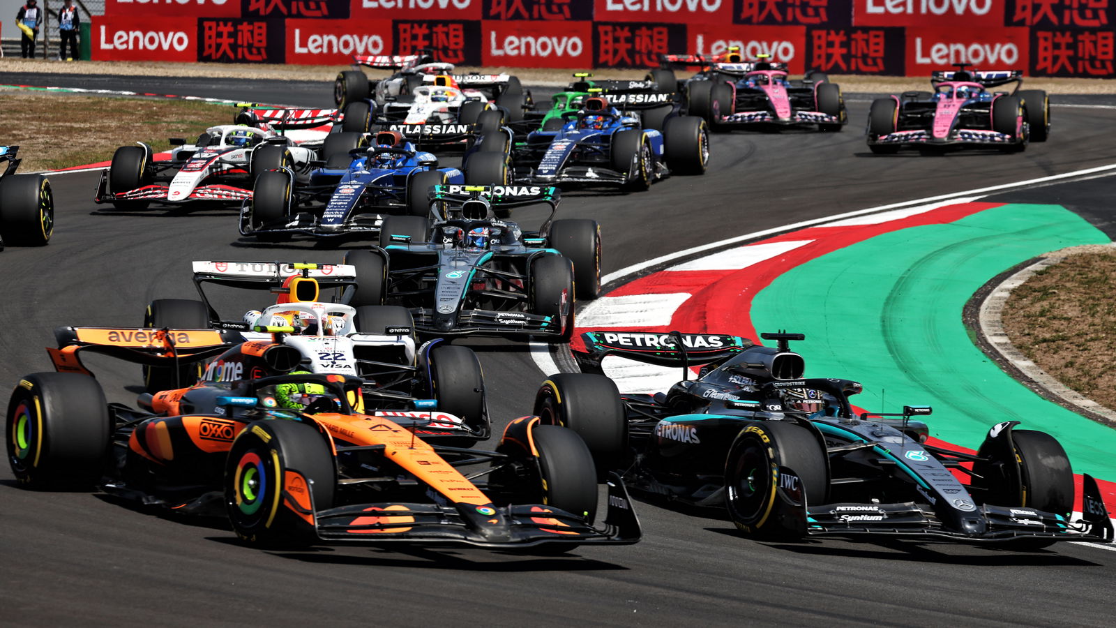 Lando Norris battles George Russell
