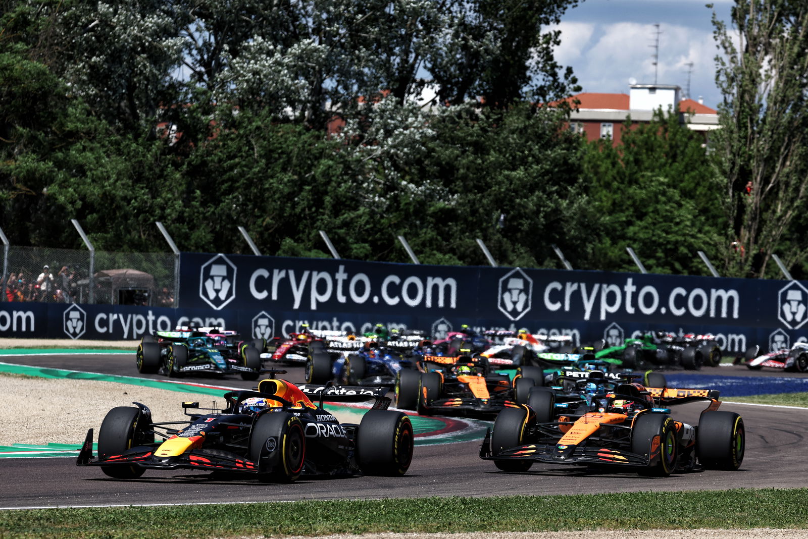 Verstappen passes Piastri at Turn 1