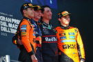 Max Verstappen and the two McLaren drivers on the Imola podium