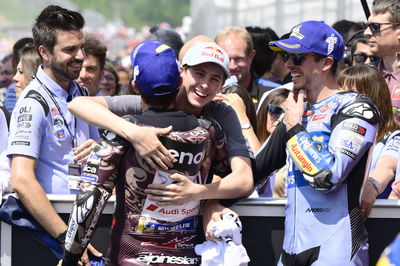 Marc Marquez, Max Quiles embrace in parc ferme, 2025 MotoGP Italian Grand Prix. Credit: Gold and Goose.