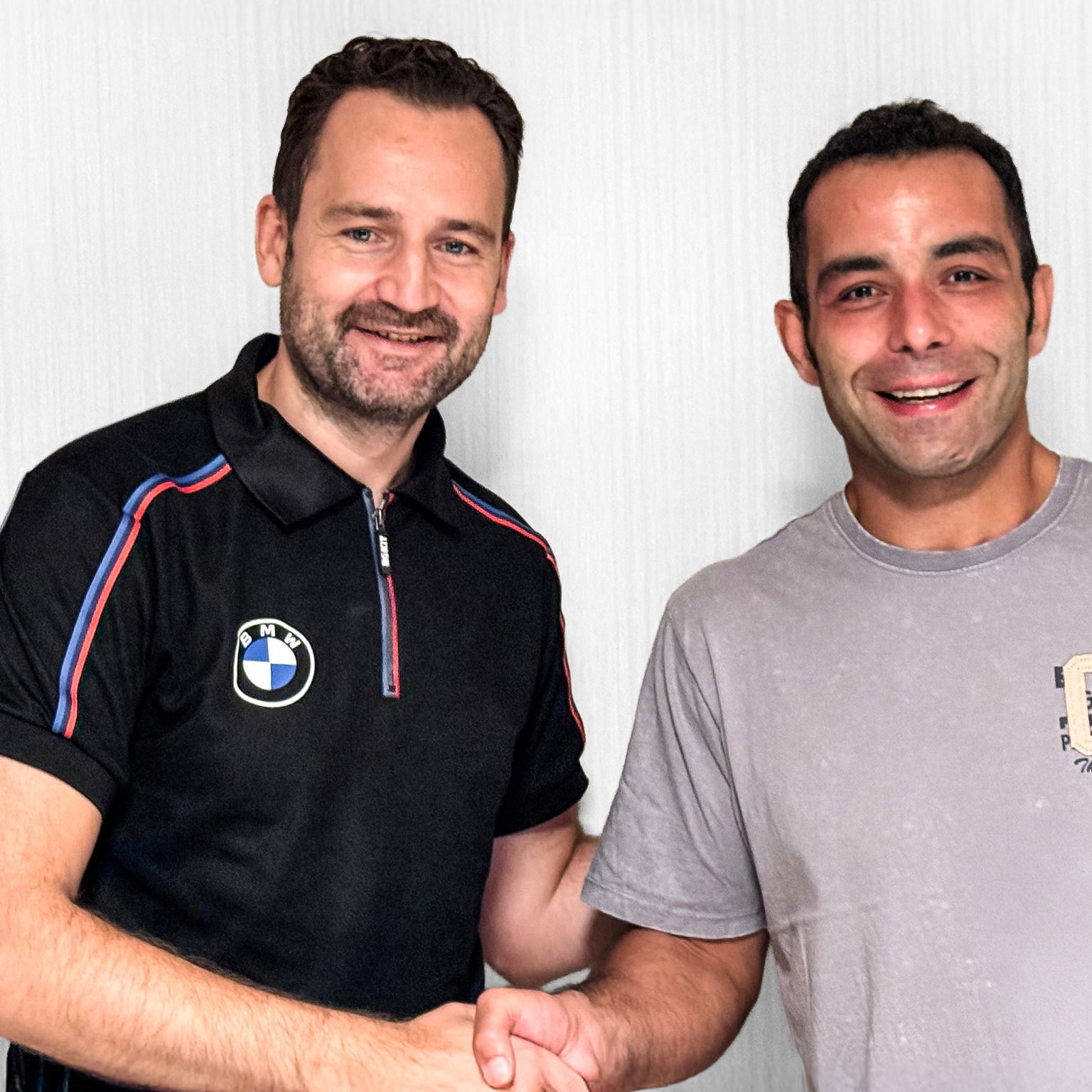 Sven Blusch shakes hands with Danilo Petrucci. Credit: BMW.