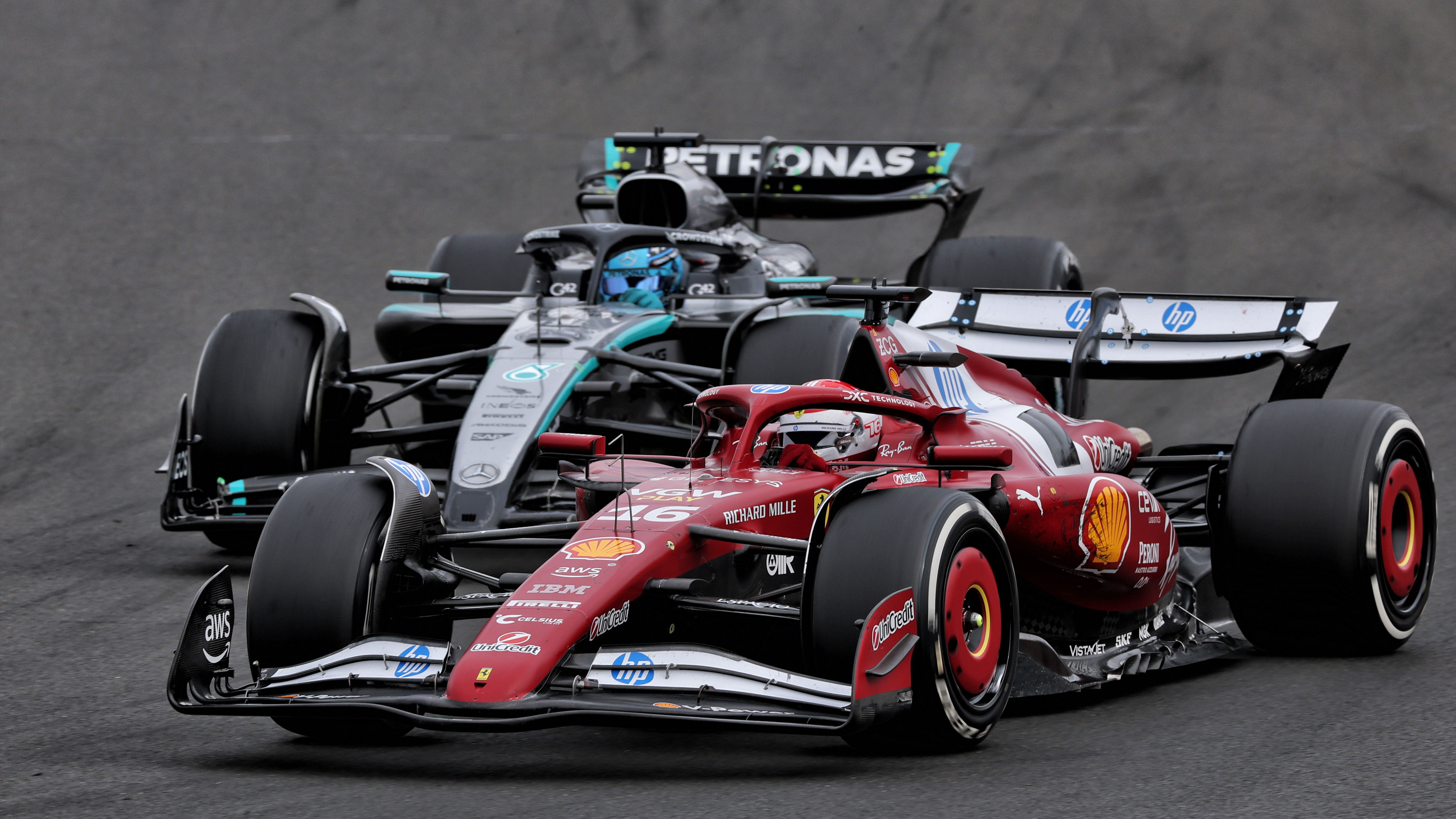 Charles Leclerc battles George Russell 