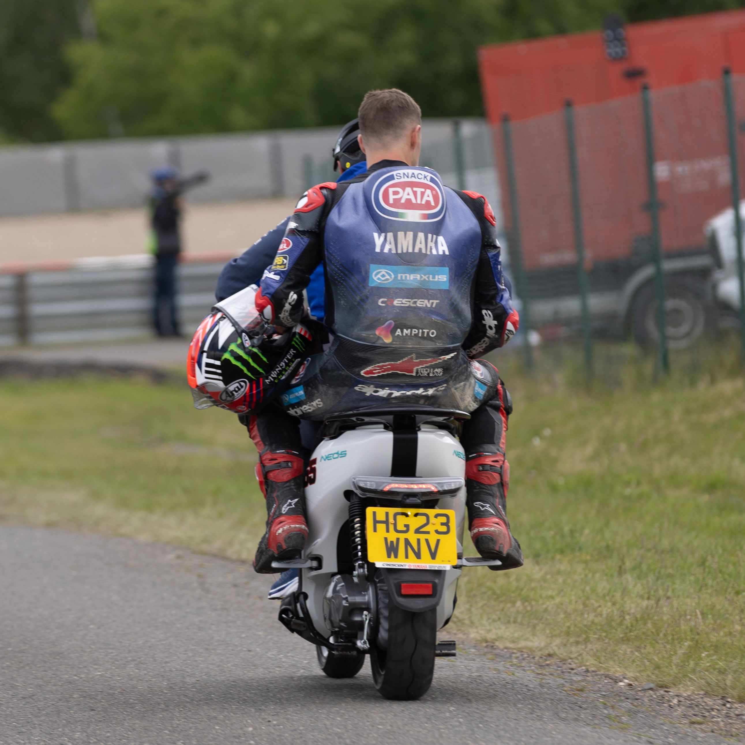 Jonathan Rea takes a scooter back to the pits, 2025 Czech WorldSBK. Credit: Gold and Goose. 