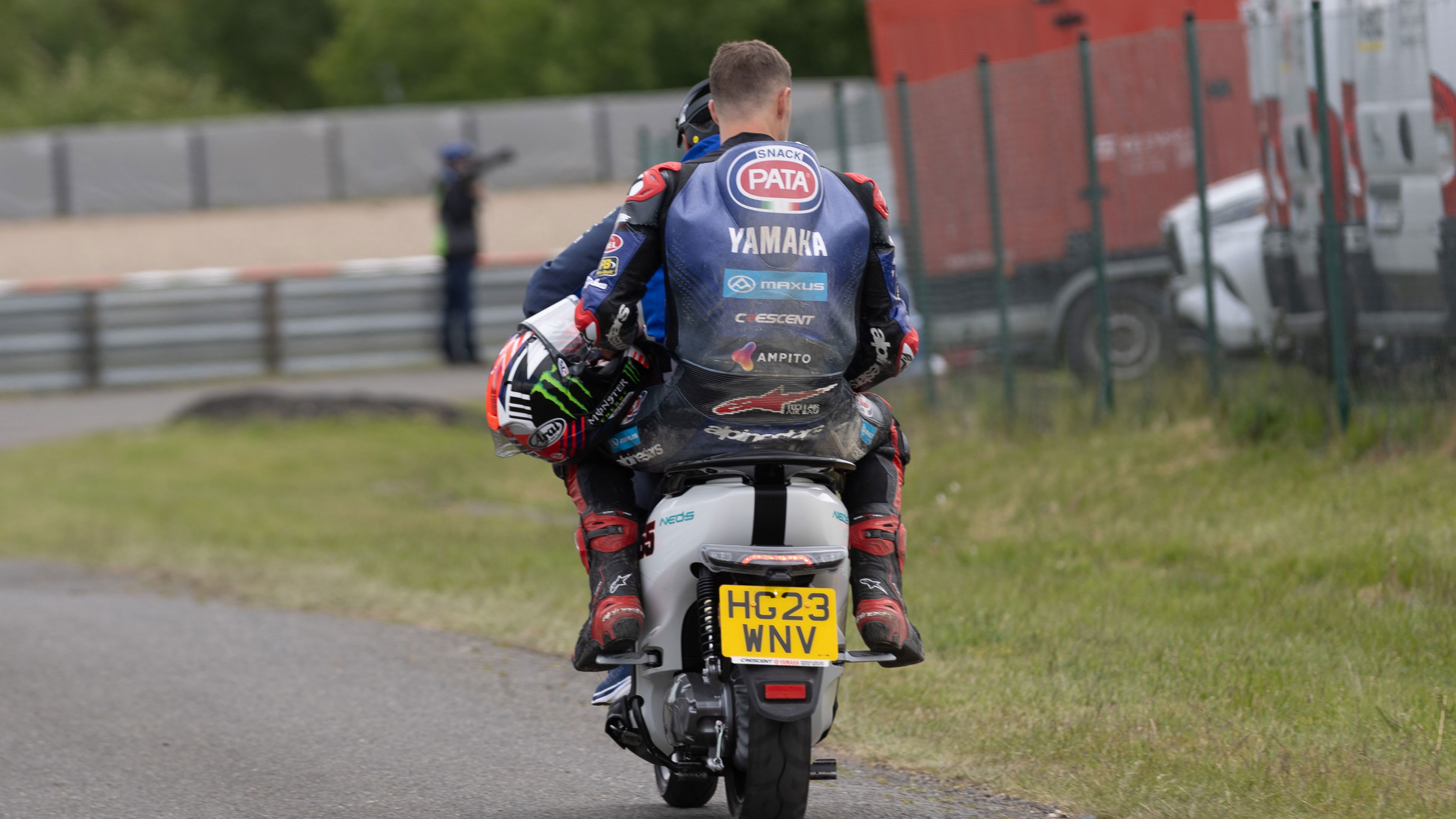 Jonathan Rea takes a scooter back to the pits, 2025 Czech WorldSBK. Credit: Gold and Goose. 