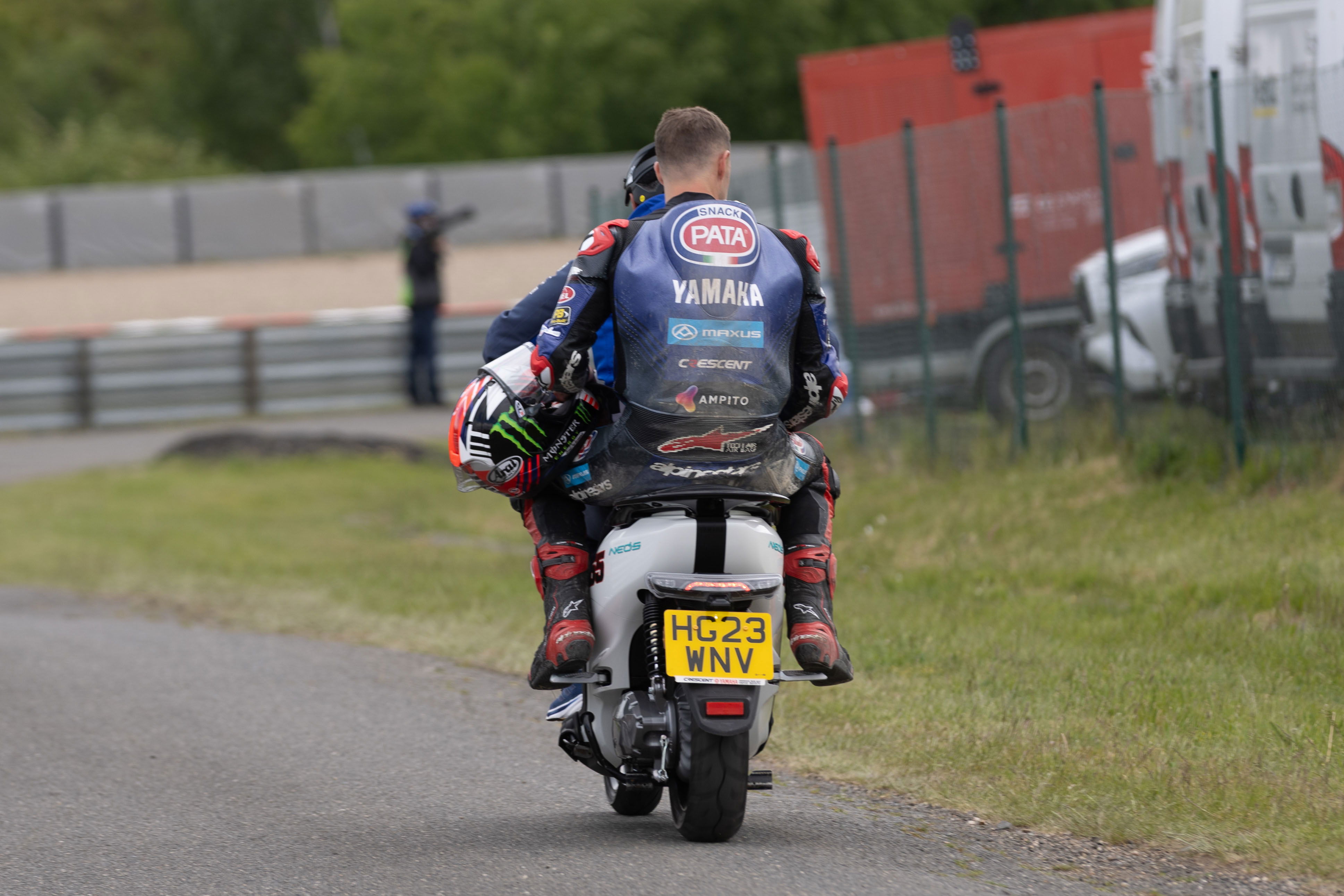 Jonathan Rea takes a scooter back to the pits, 2025 Czech WorldSBK. Credit: Gold and Goose.