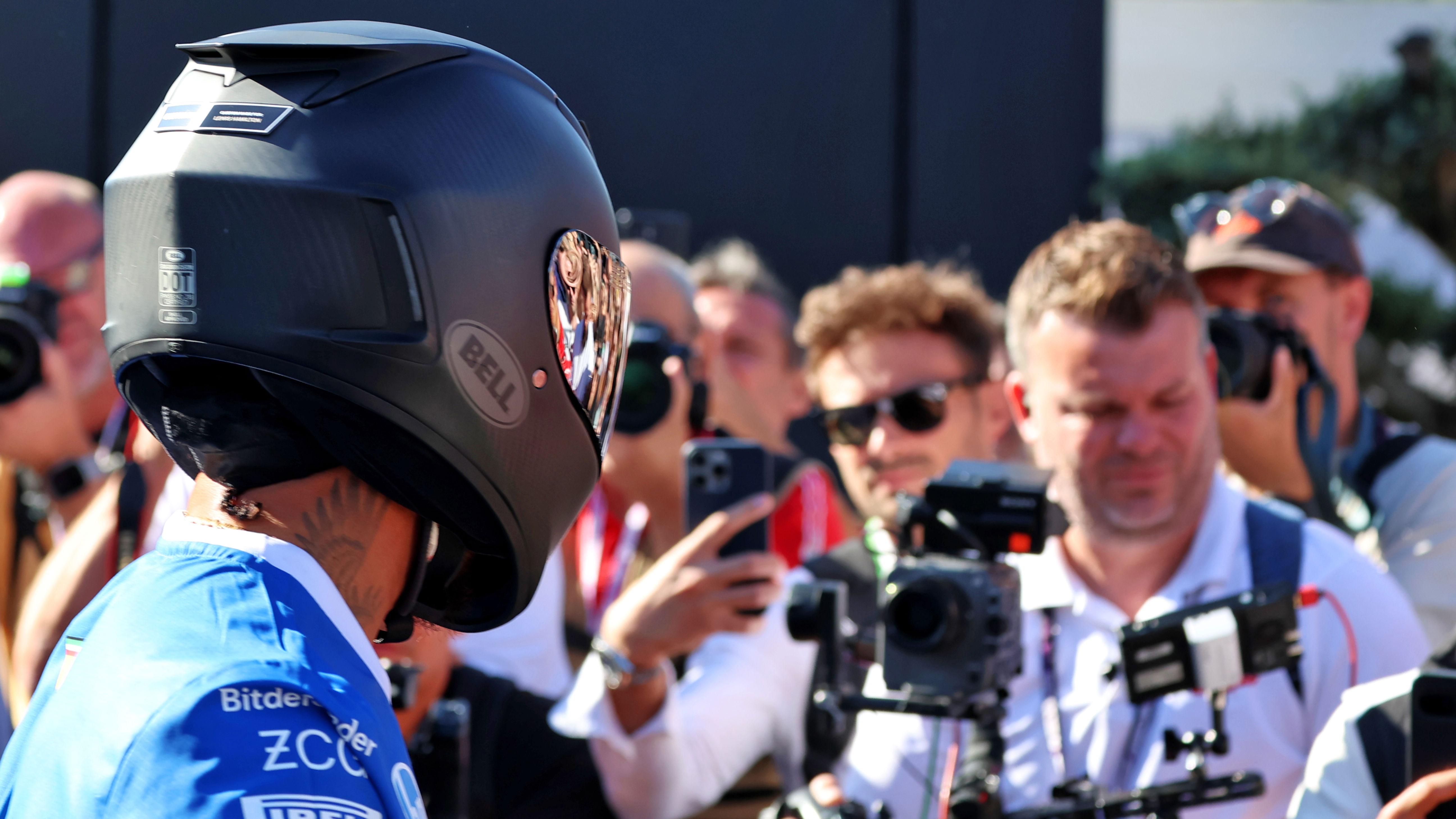 Hamilton arrives on a Ducati