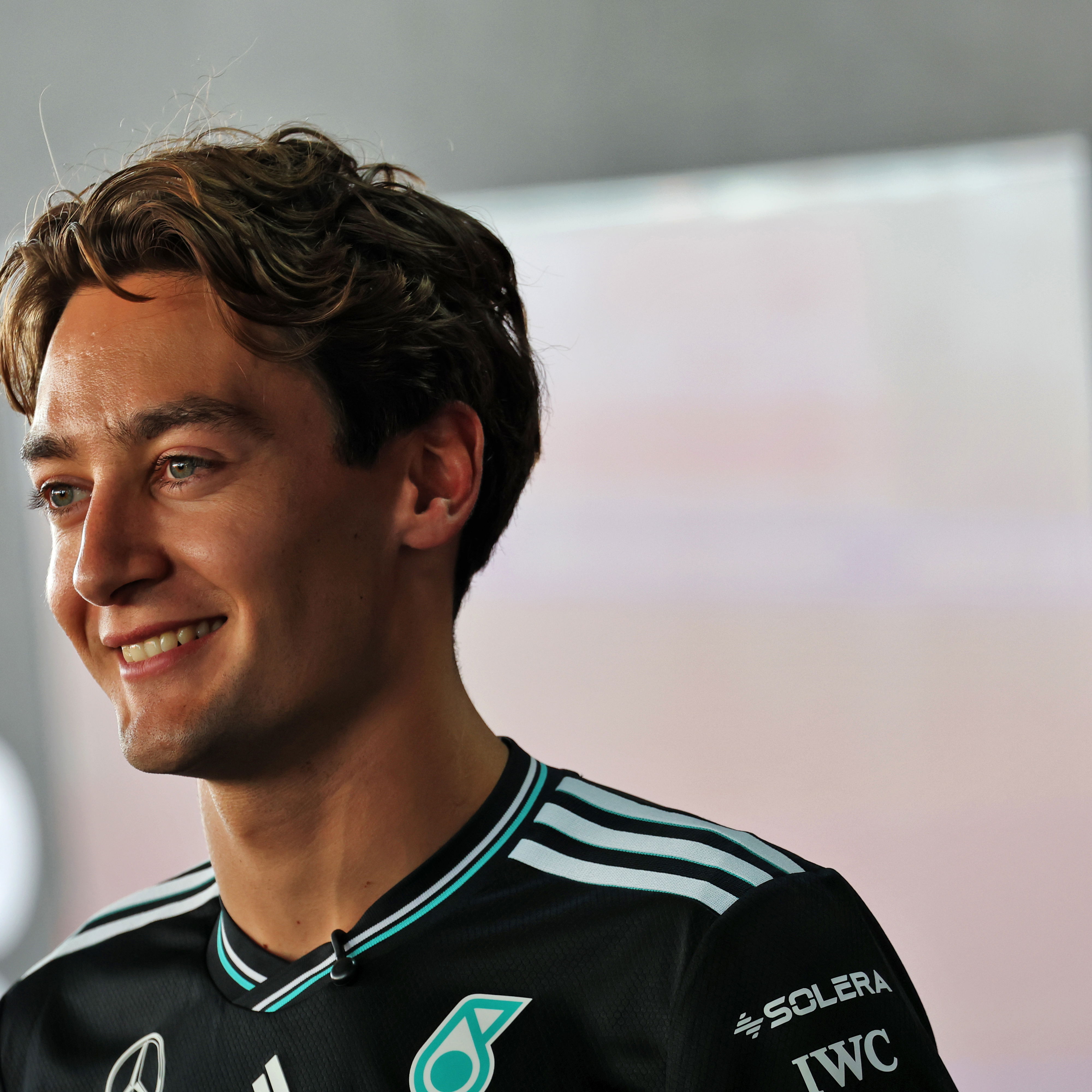 Russell watched the action from the grandstands 