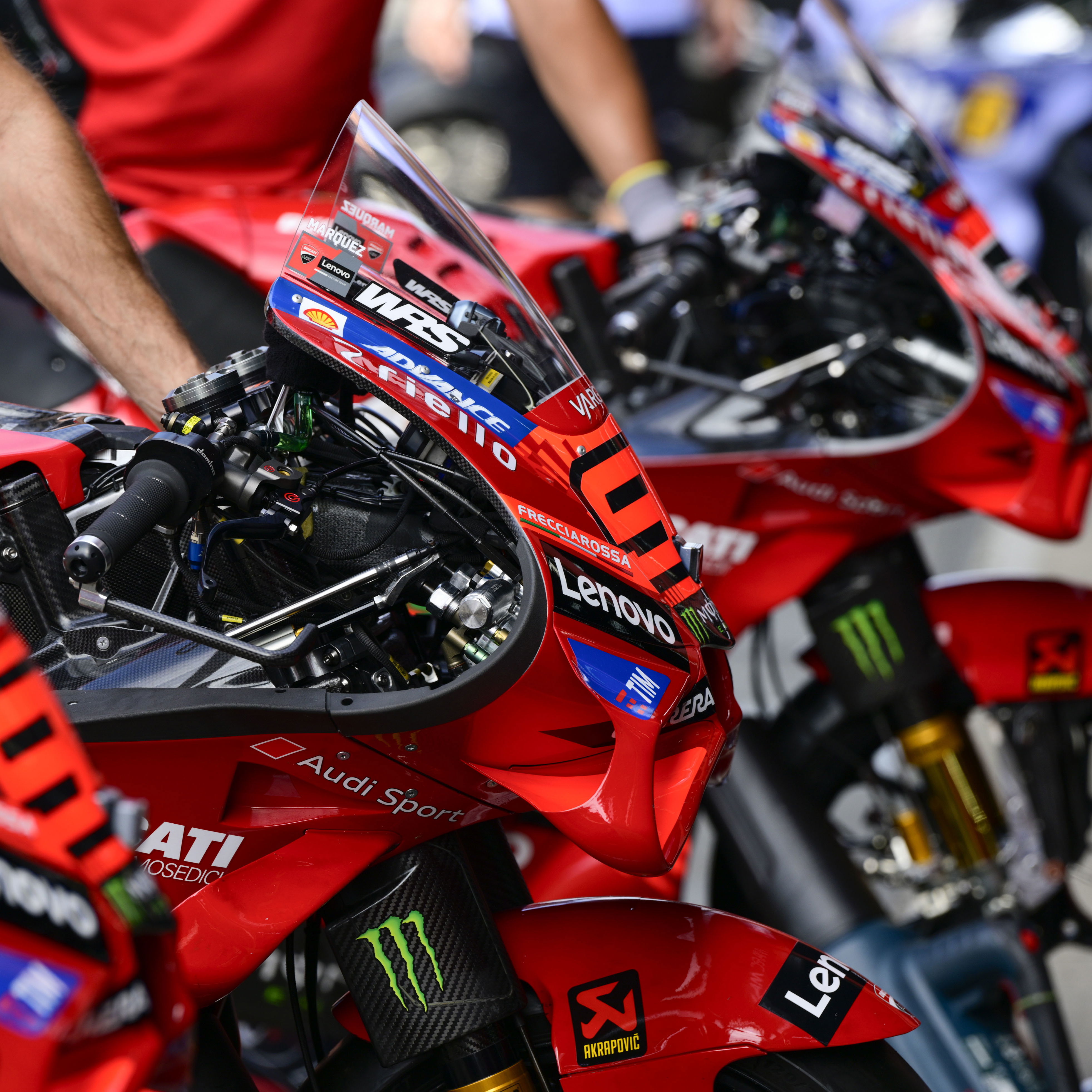 Marc Marquez, Pecco Bagnaia Ducati Desmosedici GP25s, 2025 MotoGP Japanese Grand Prix, pit lane. Credit: Gold and Goose.