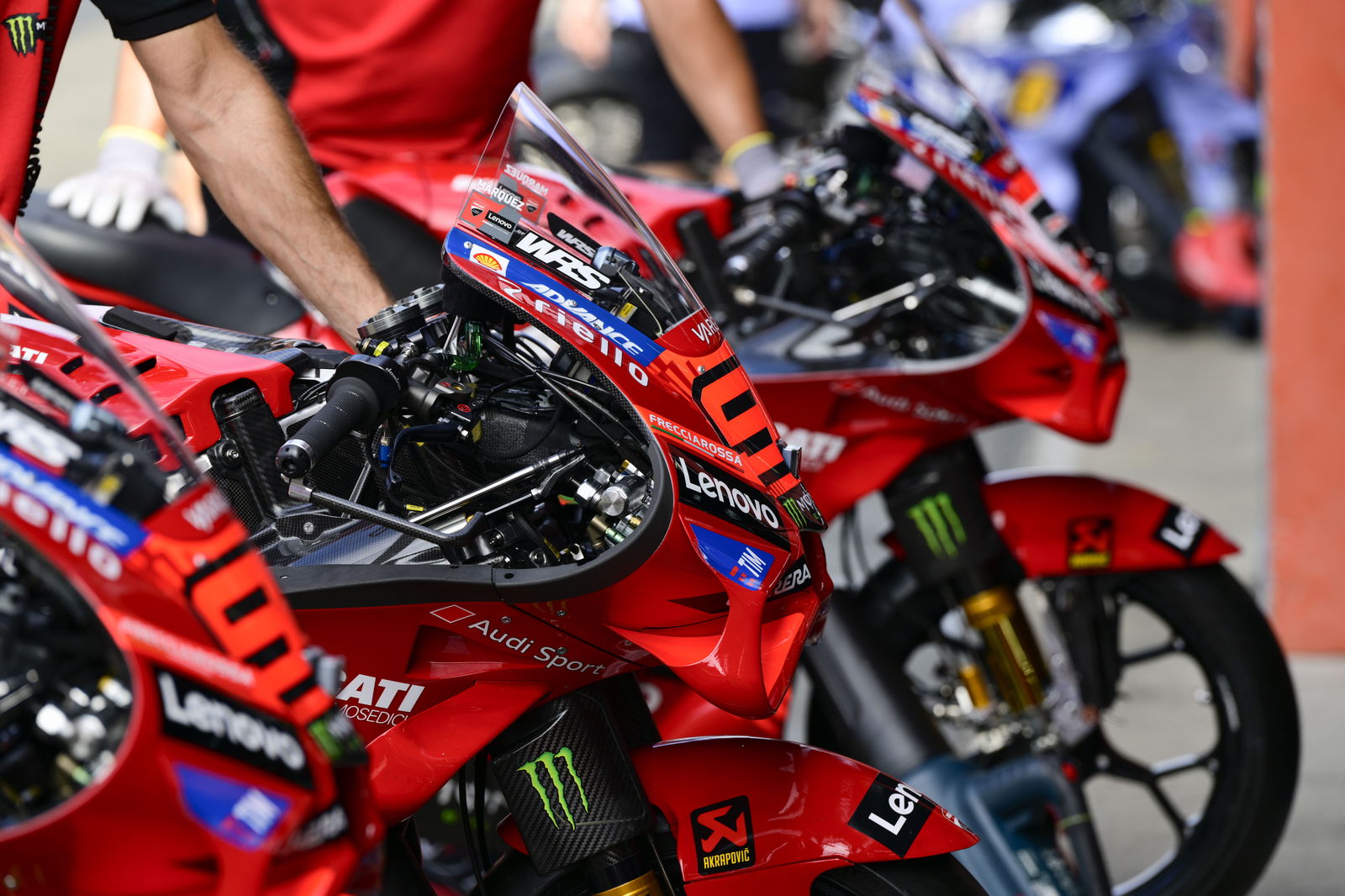 Marc Marquez, Pecco Bagnaia Ducati Desmosedici GP25s, 2025 MotoGP Japanese Grand Prix, pit lane. Credit: Gold and Goose.