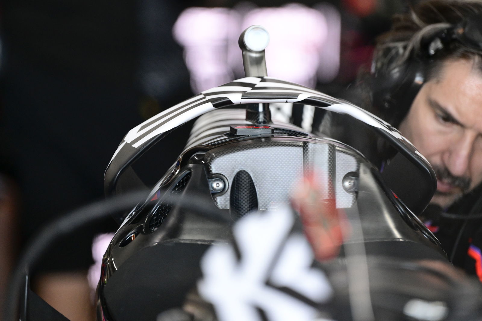 Hoop rear wing on Marco Bezzecchi's Aprilia, 2025 MotoGP Valencia Test, pit box. Credit: Gold and Goose.