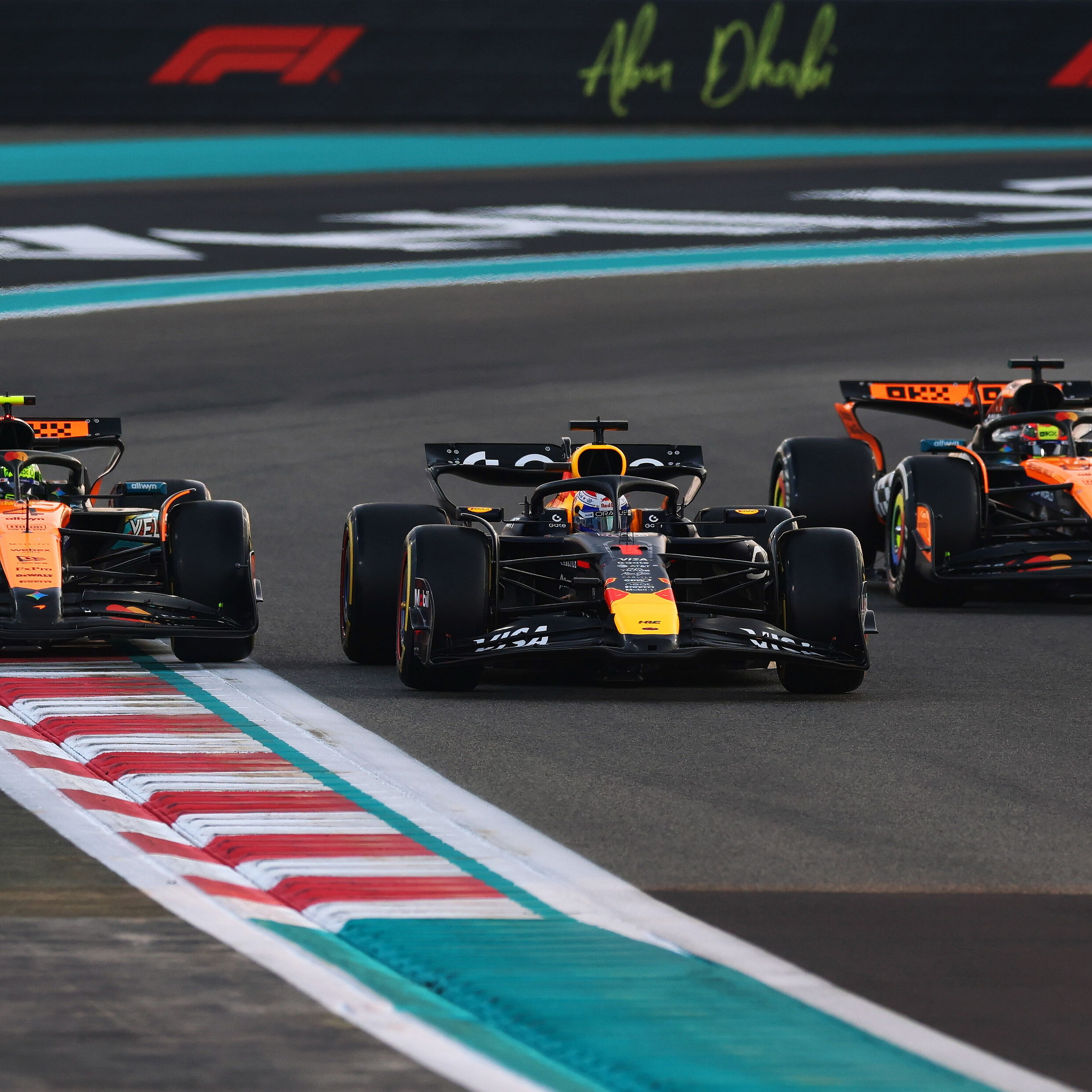 Verstappen fends off the McLarens at the start