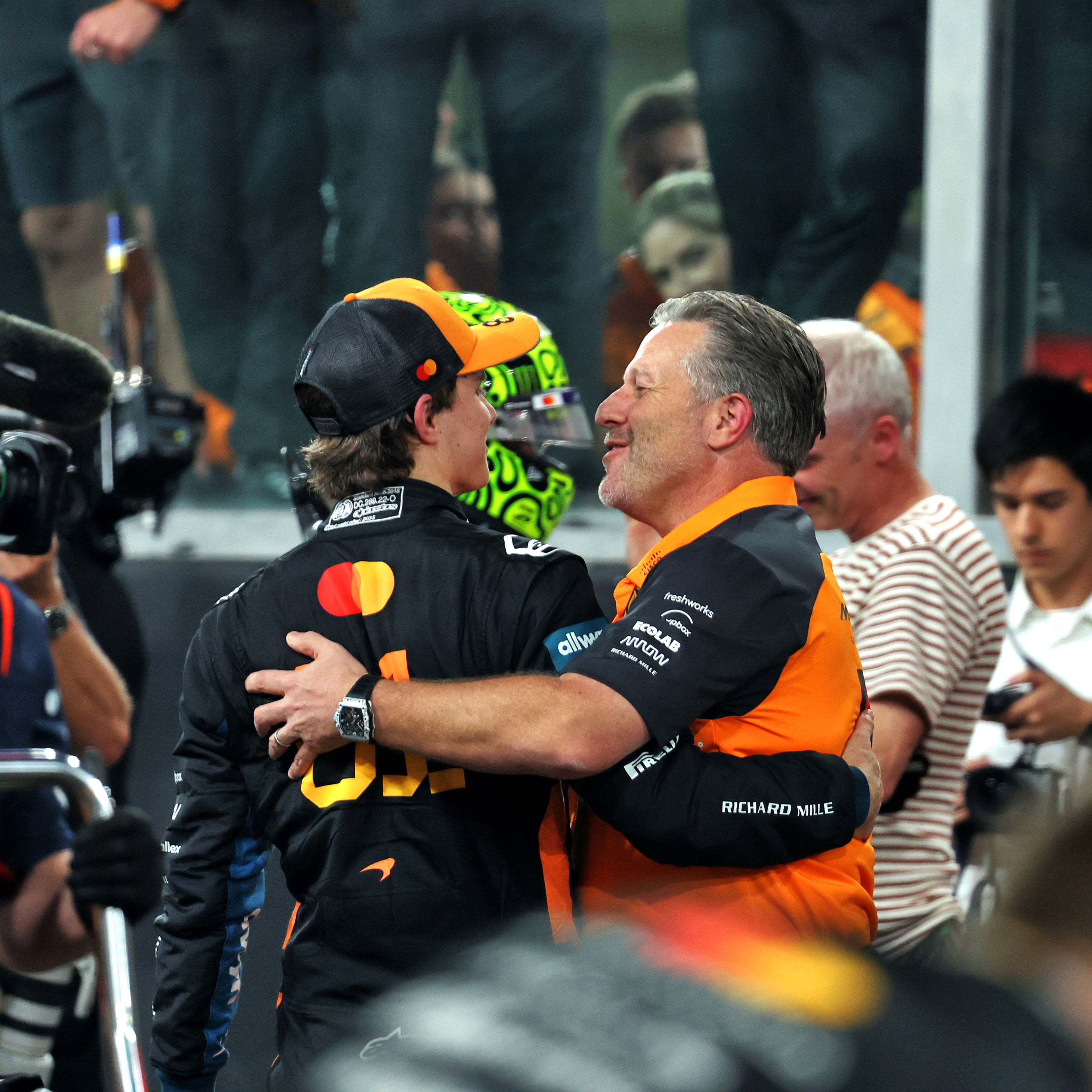 Brown embraces Piastri after the Abu Dhabi GP