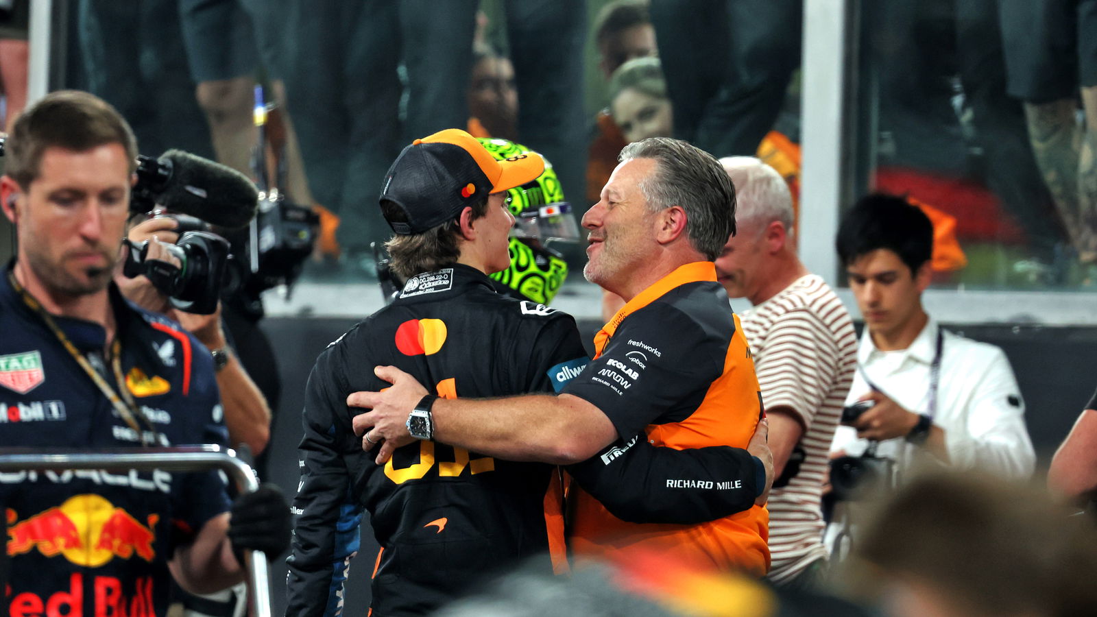 Brown embraces Piastri after the Abu Dhabi GP