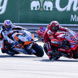 Ai Ogura chases Francesco Bagnaia, 2025 Thai MotoGP Sprint.