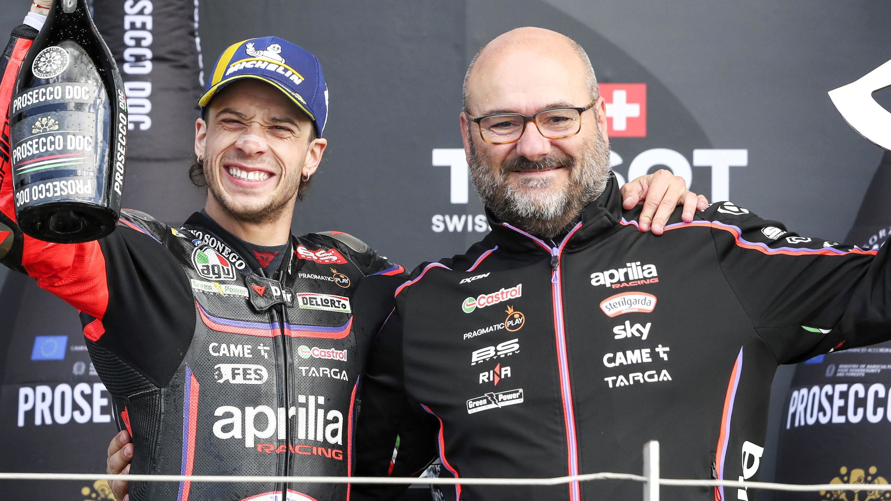 Marco Bezzecchi and Fabiano Sterlacchini celebrate a 2025 MotoGP victory.
