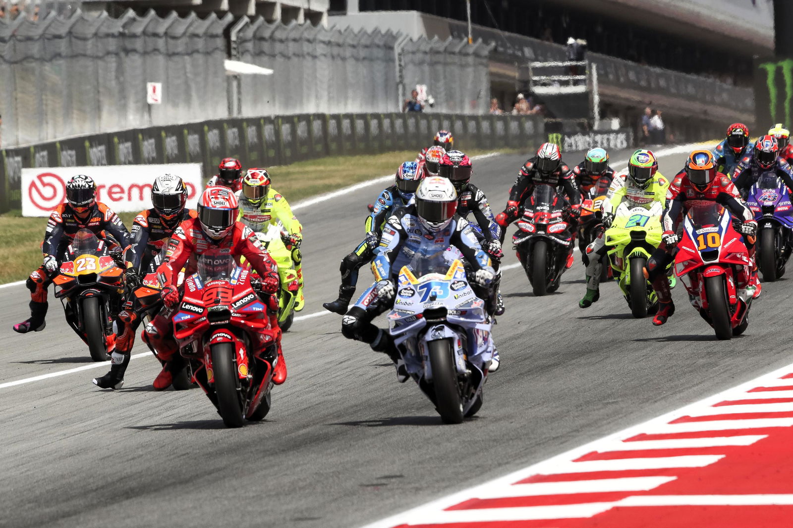 Marc Marquez, Alex Marquez lead the field into Turn 1 at the 2025 Catalan MotoGP.