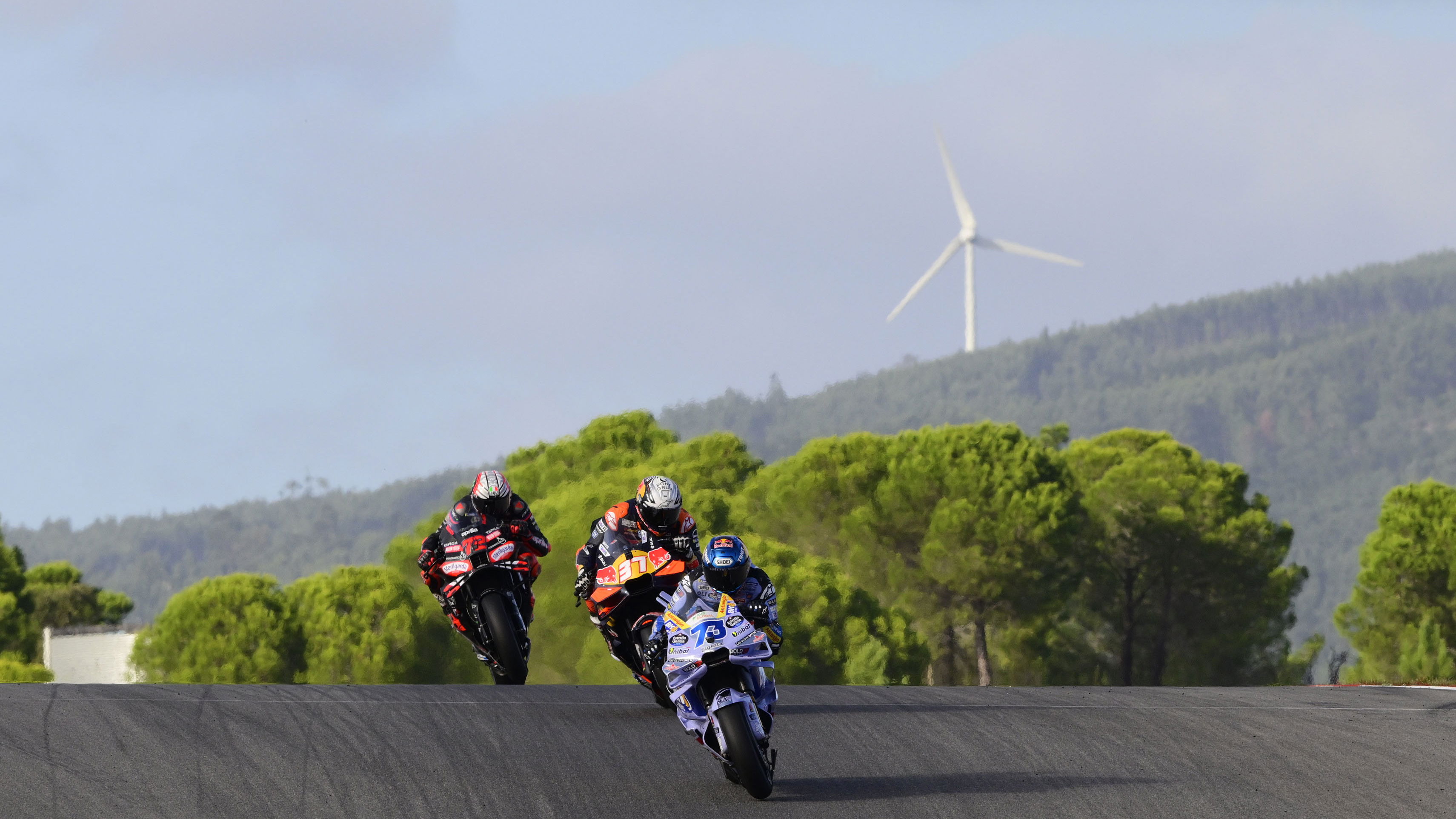 Alex Marquez leads Pedro Acosta, Marco Bezzecchi, 2025 MotoGP Portuguese Grand Prix, Sprint. Credit: Gold and Goose.