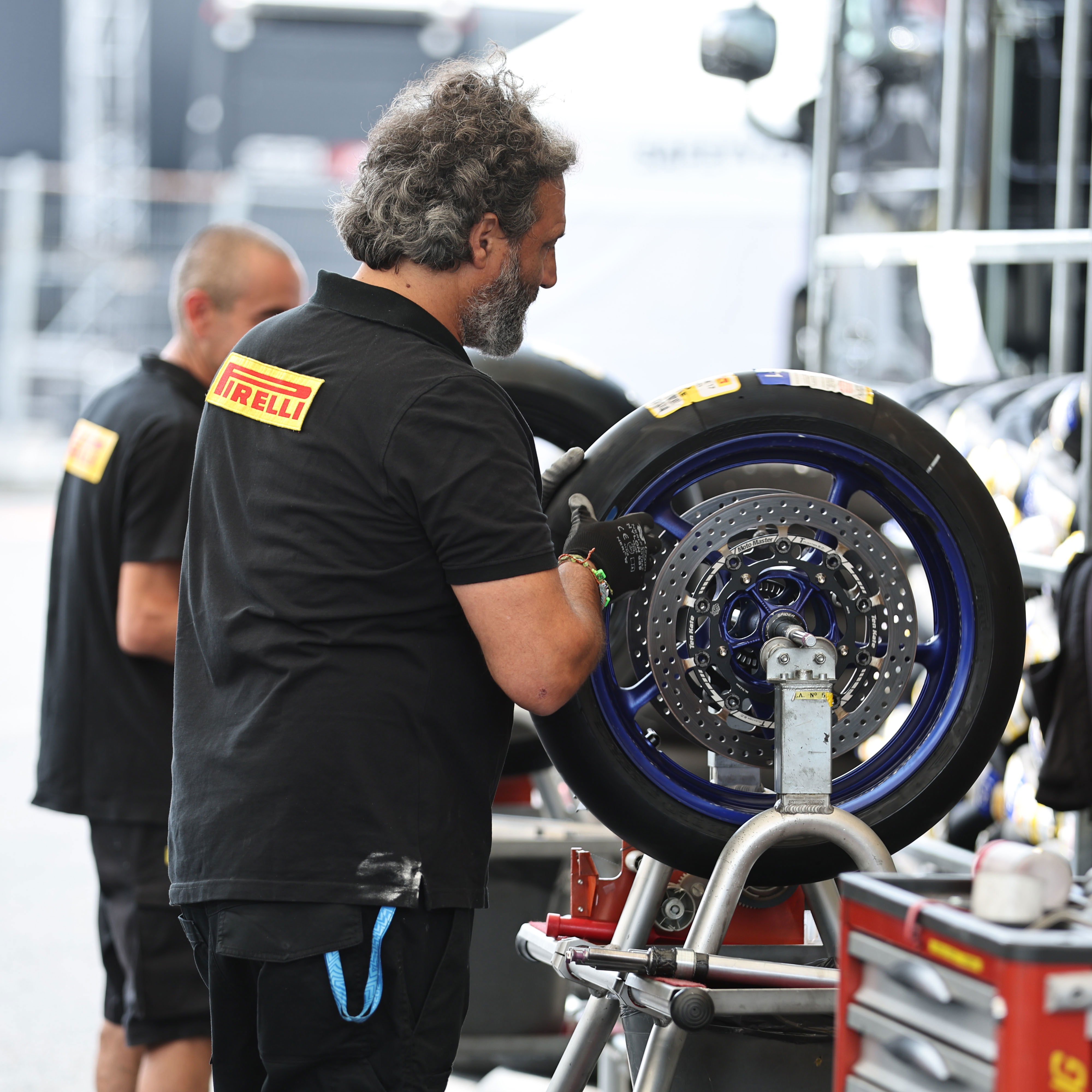 Pirelli tyre fitter, 2024 Czech WorldSBK. Credit: Gold and Goose.