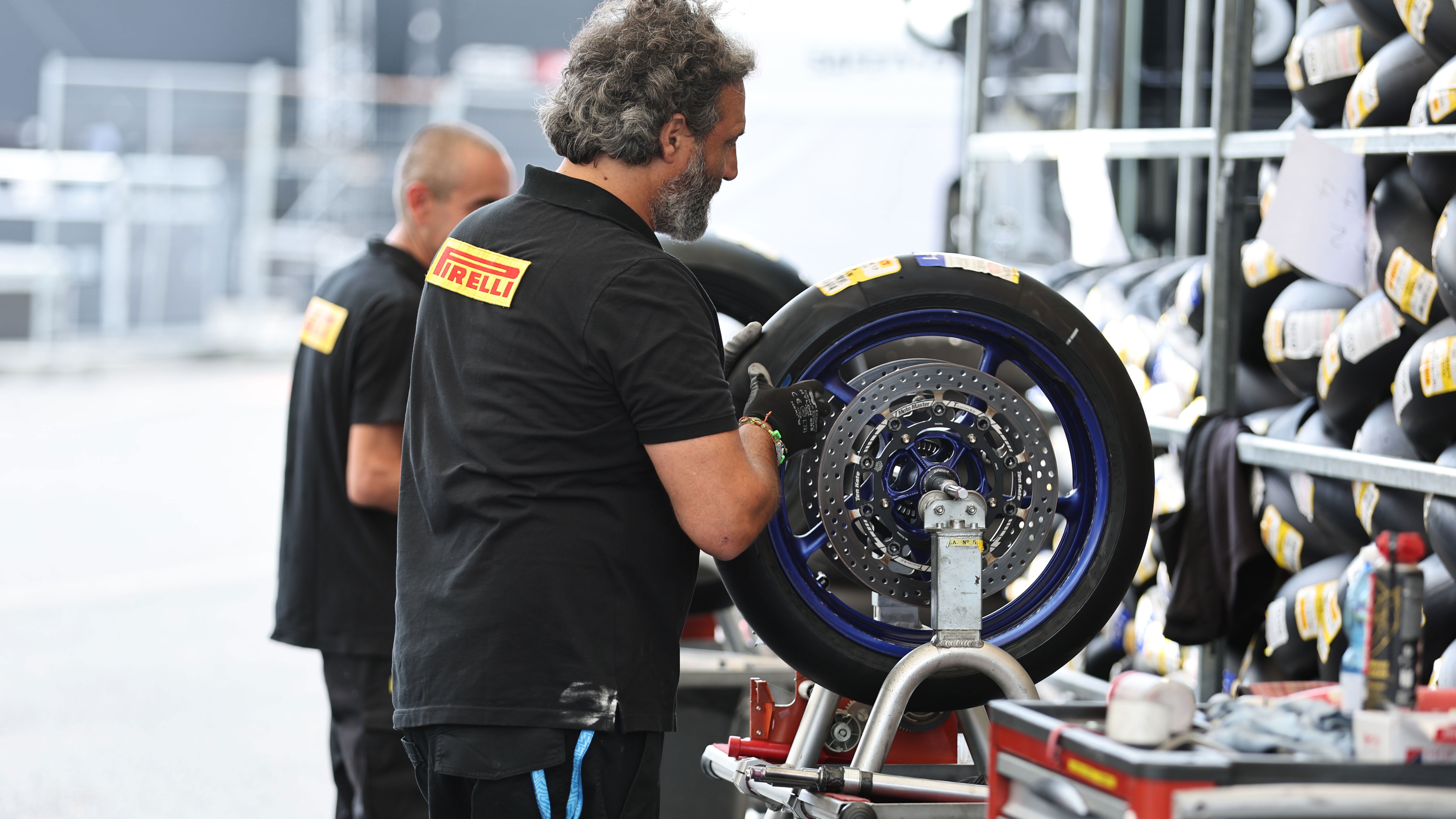 Pirelli tyre fitter, 2024 Czech WorldSBK. Credit: Gold and Goose.