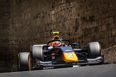 Why is a Red Bull junior testing an F1 car for McLaren?