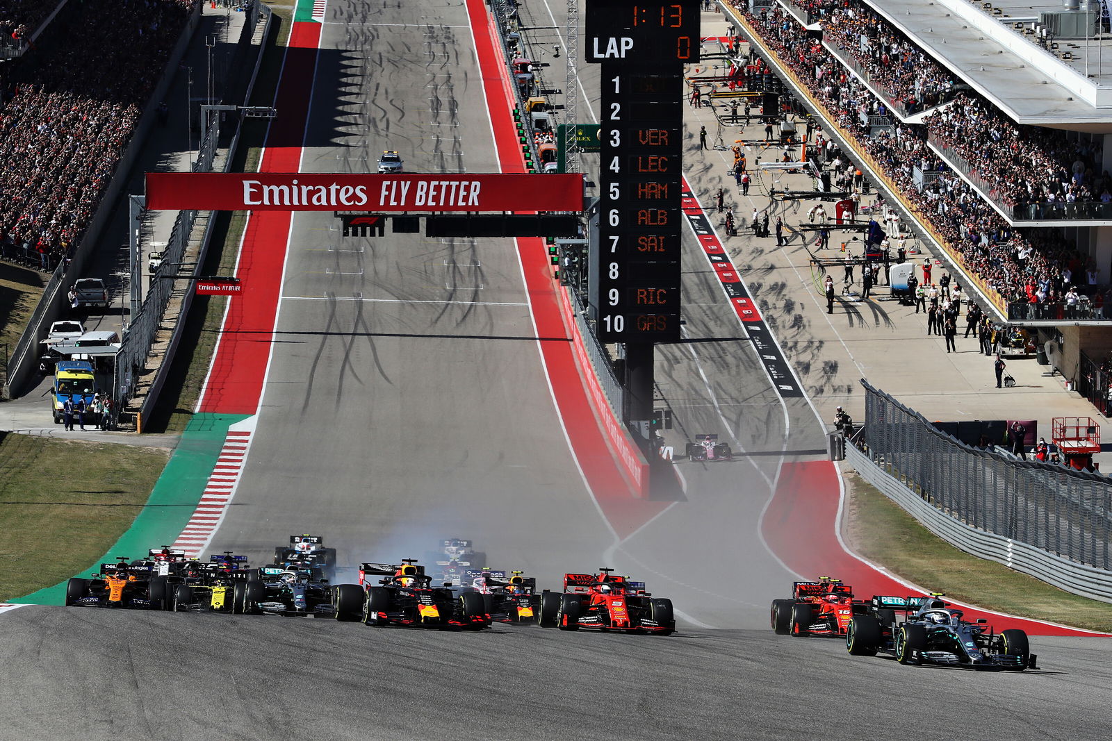 Bottas makes late pass for US GP victory as Hamilton clinches title