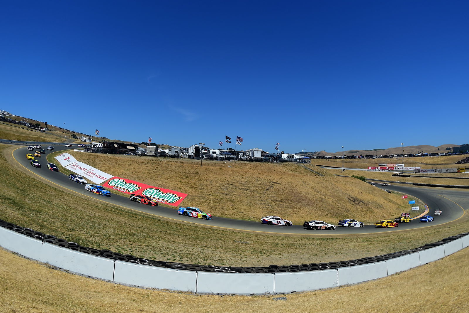 Martin Truex, Jr fends off teammate Kyle Busch for Sonoma race win