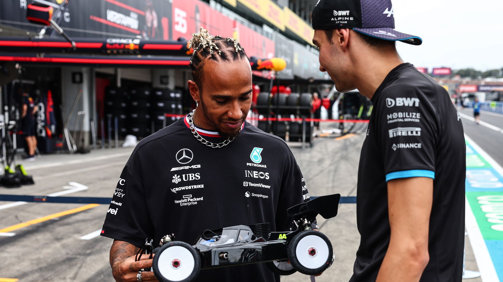 Hamilton rekindles childhood passion with remote control car race at Suzuka