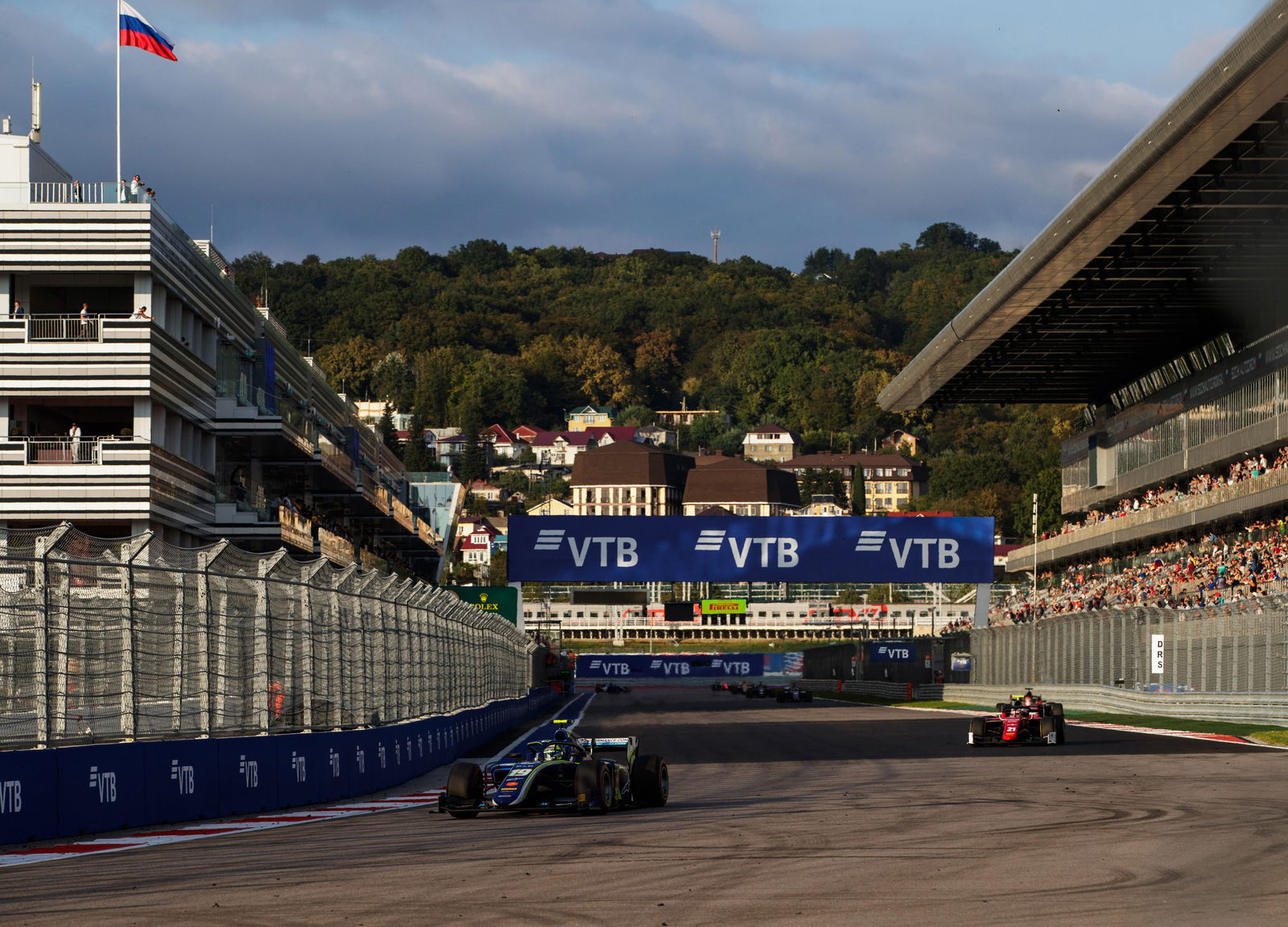 Russell on brink of F2 title after victory in rain-hit race